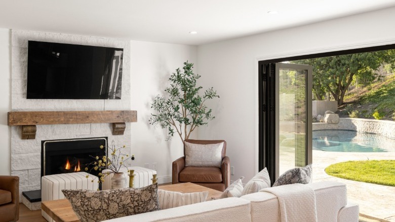 A TV above the fireplace