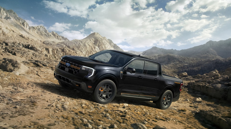 Black 2026 Ford Maverick parked at an angle in a rocky landscape