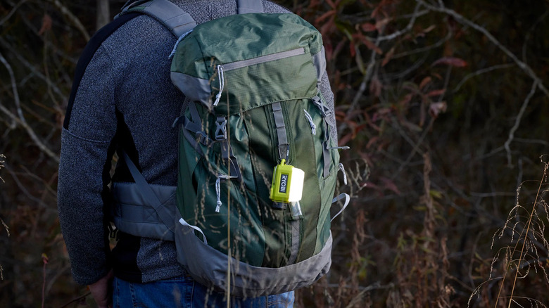 Ryobi compact area light attached to a backpack.