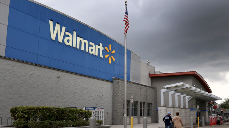 A picture of a Walmart on a stormy day.