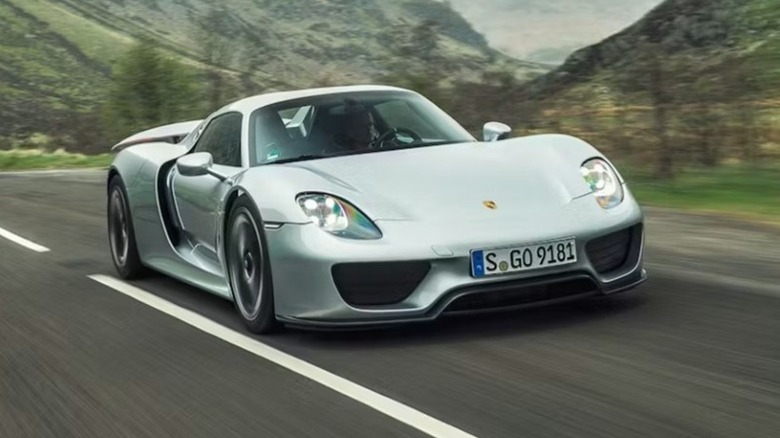 Porsche 918 Spyder driving through mountains
