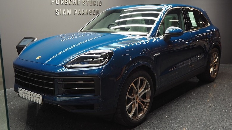 Porsche Cayenne Turbo E-Hybrid parked inside a Porsche studio