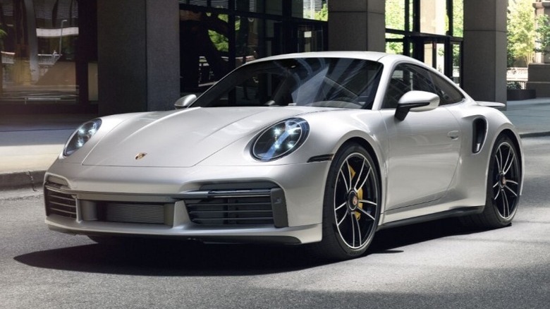992-generation Porsche 911 Turbo S parked on a paved surface in front of a building