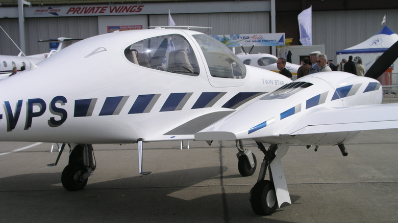 A white diamond DA42 Twin Star at an airshow.