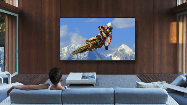 Woman watching Sony 8K TV