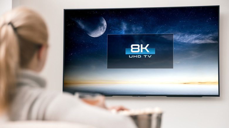 Woman watching 8K TV