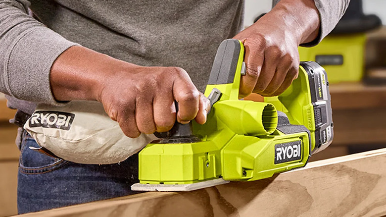 The Ryboi Hand Planer being used to cut groves along the side of lumber