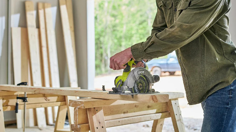 The compact HP cordless Circular Saw being used at a workstation