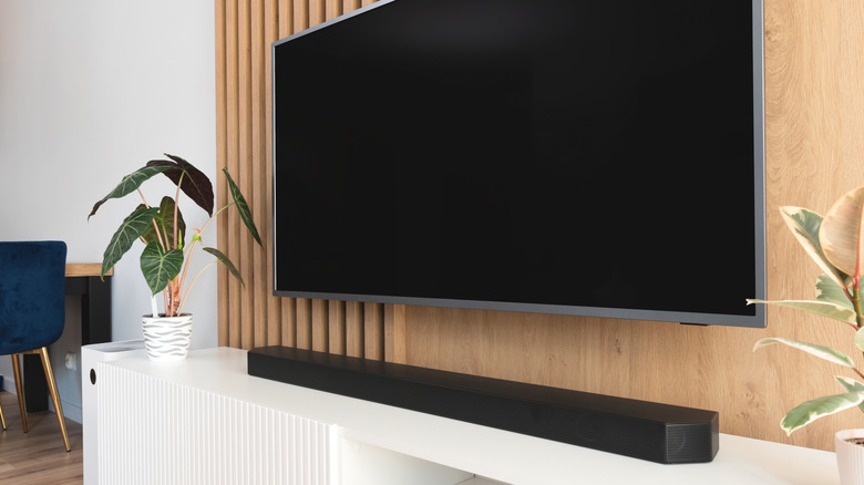 soundbar set up on a stand below tv