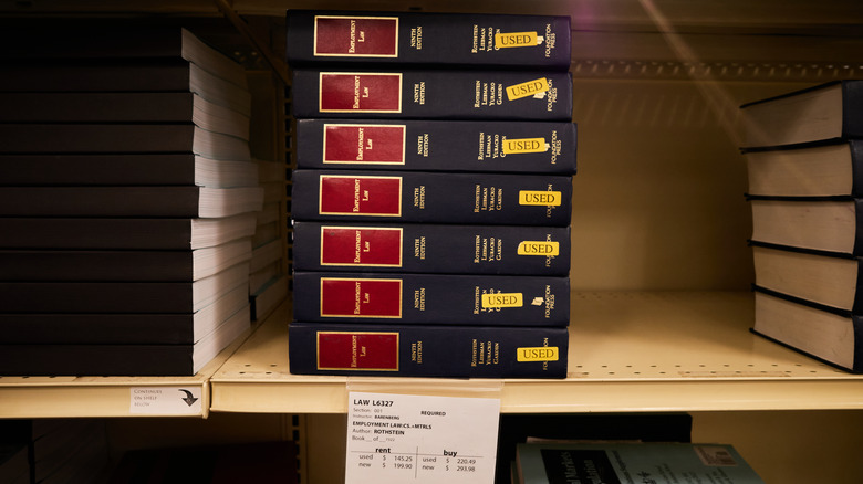 stack of textbooks at a bookstore