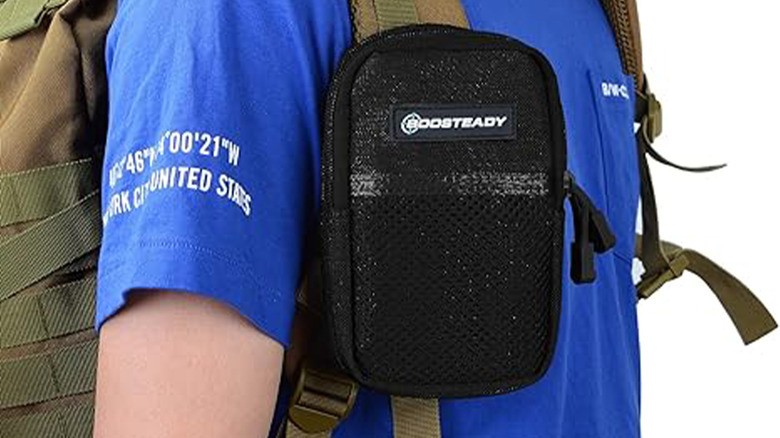 strap bag attached to backpack