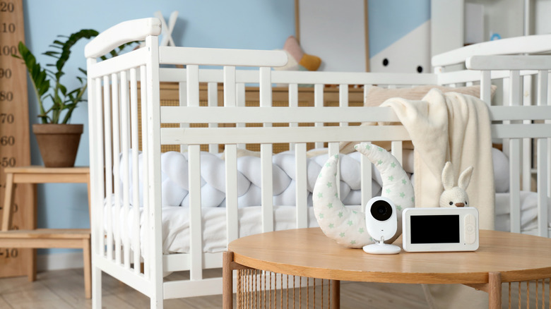 Baby monitor next to crib