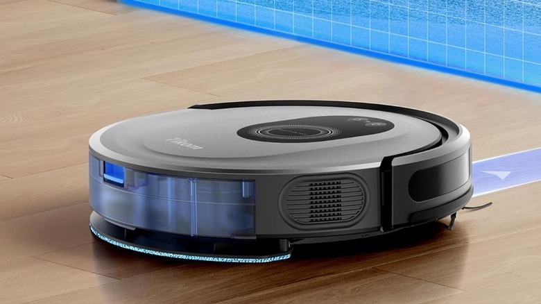 Tikom robot vacuum and mop cleaning a wooden floor