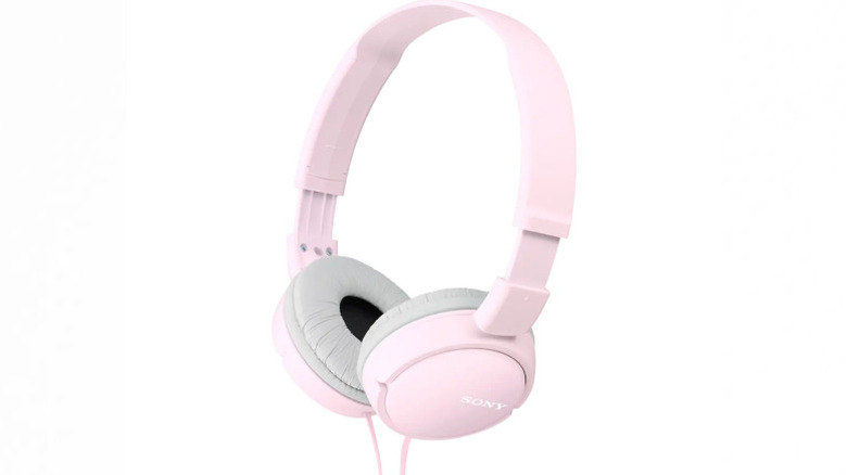 Pink Sony MDR-ZX110 wired headphones against a white background