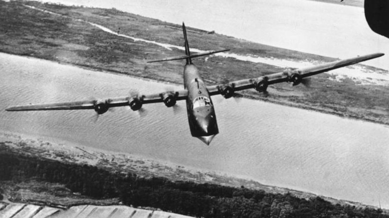 a Blohm Und Voss Bv 222 flying over a canal