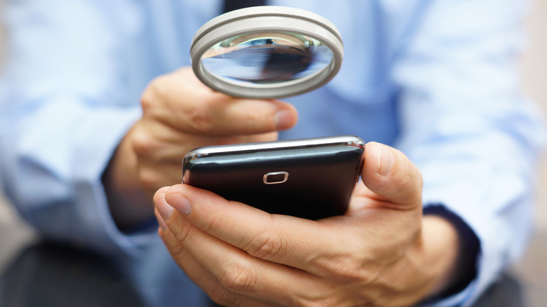 Man holding a magnifying glass