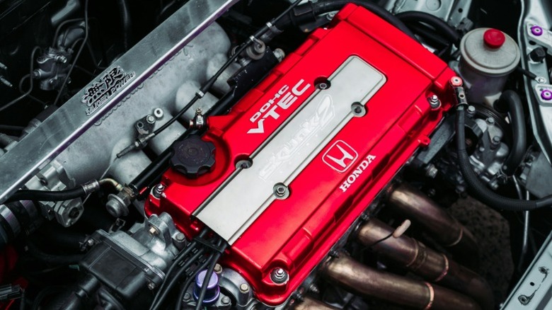 Honda VTEC engine with red valve cover in engine bay