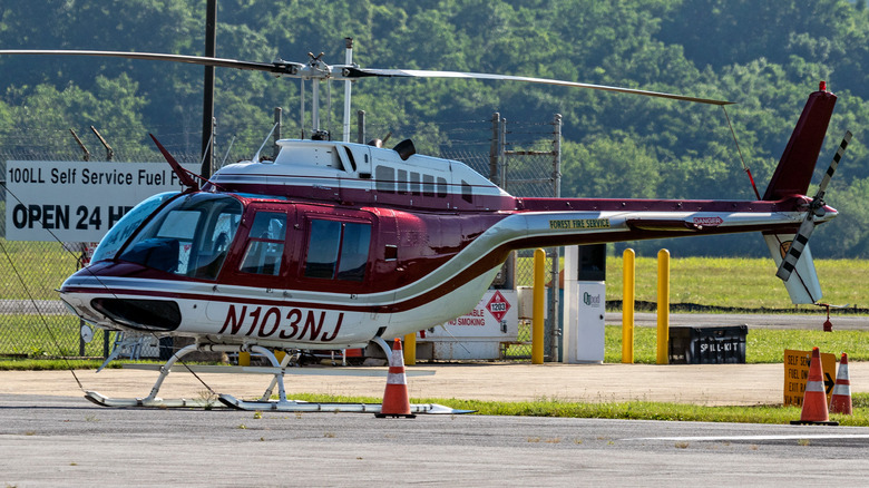 A Bell 206 JetRanger helicopter preparing for takeoff.