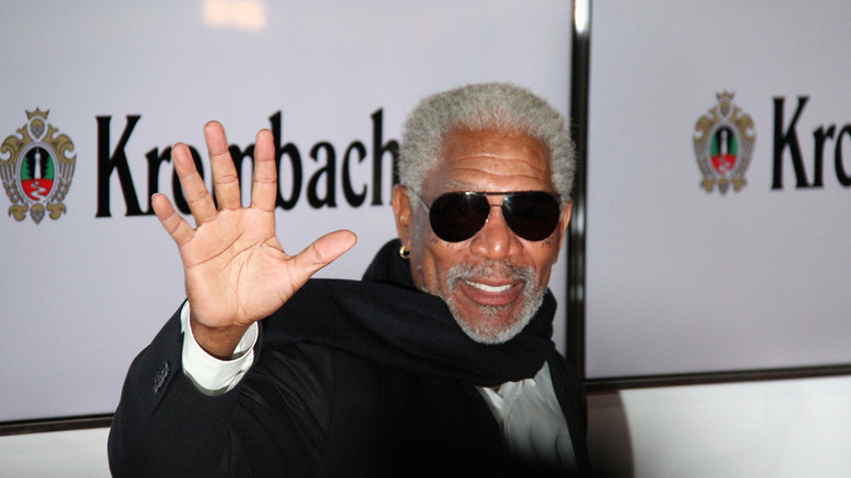 Morgan Freeman waving at the camera at a German event.