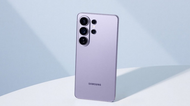 A lavender Samsung Galaxy S26 phone standing upright on a white table against a studio back drop.