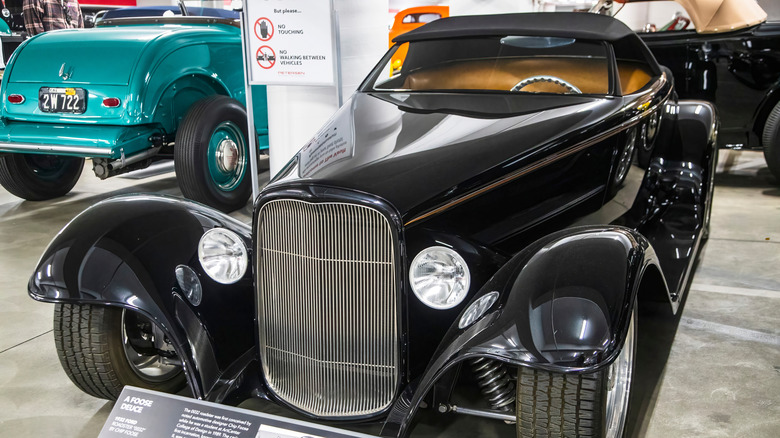 chopped hot rod parked on basketball court