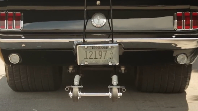 Rear end of a tubbed Ford Mustang