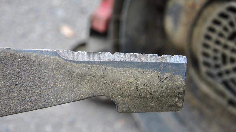 a damaged lawn mower blade