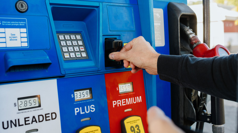 A woman filling up her tank