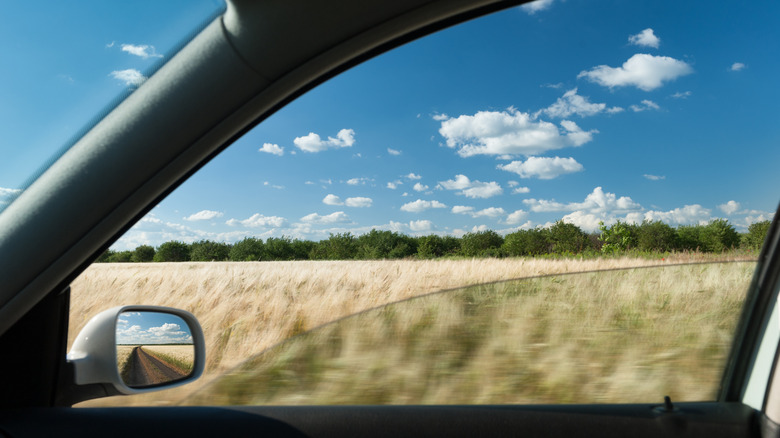 a man sitting in a car looking thoughtful