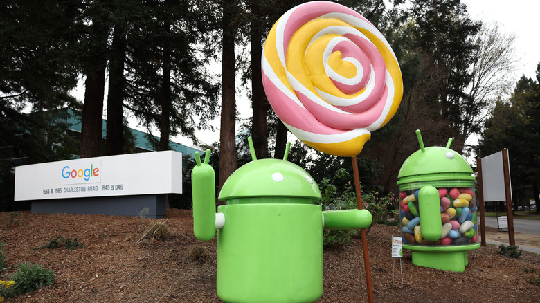 Two Android robots standing in front of Google HQ