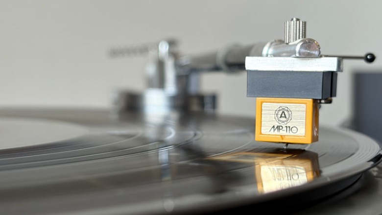 Close-up of Nagaoka MP-110 cartridge on a vinyl record.