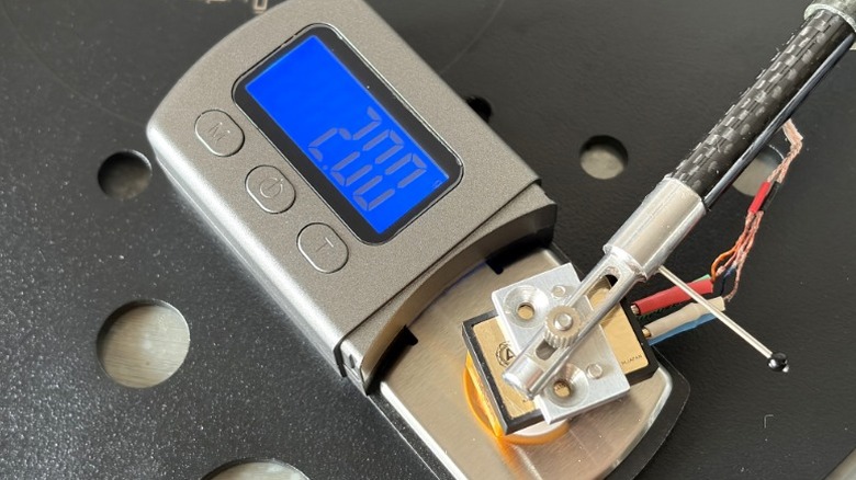 Top-down view of Nagaoka MP-110 cartridge on a stylus force gauge.