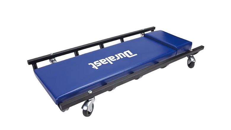 Steel creeper with blue foam padding and black side rails