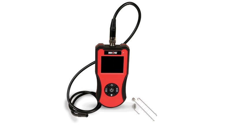 Red and black inspection camera with a black snack cable and accessories