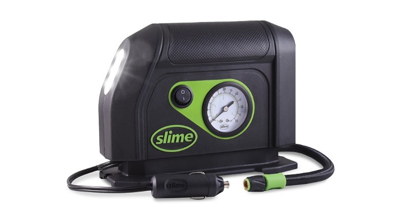 Black tire inflator with a nozzle and adapter