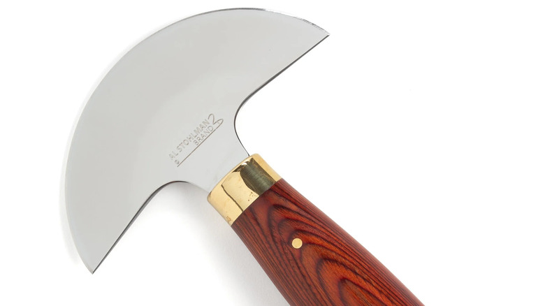 Al Stohlman Round Knife with a focus on the blade and handle