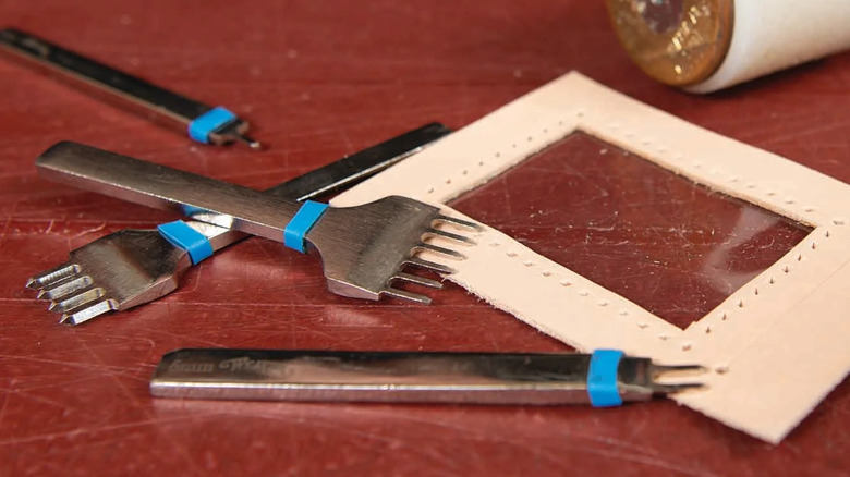 Series of chisel set next to a piece of leather