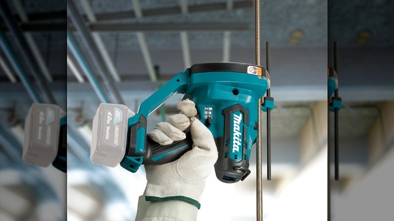 Cutting a rod using Makita rod cutter.