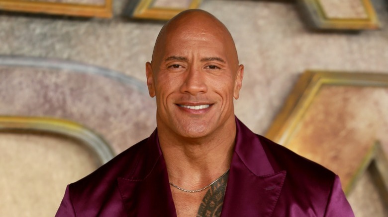 Dwayne Johnson in a purple suit