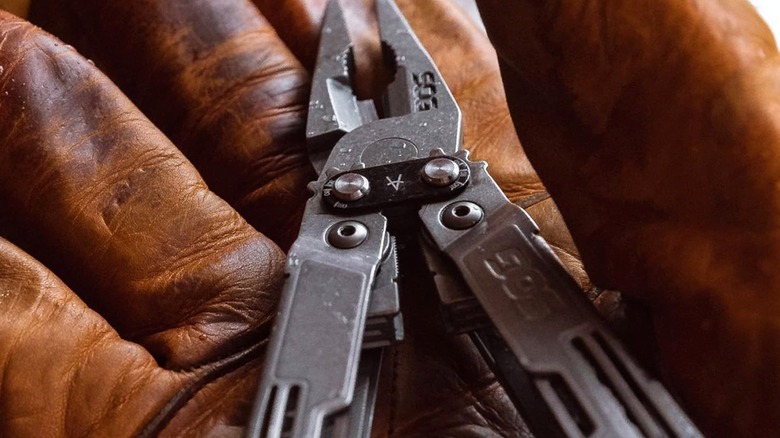 A multitool in a glove.