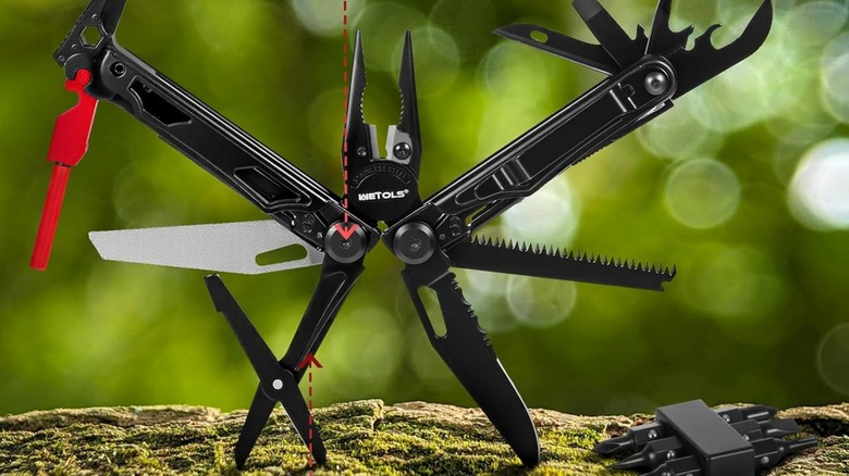 A multitool open with a green background.