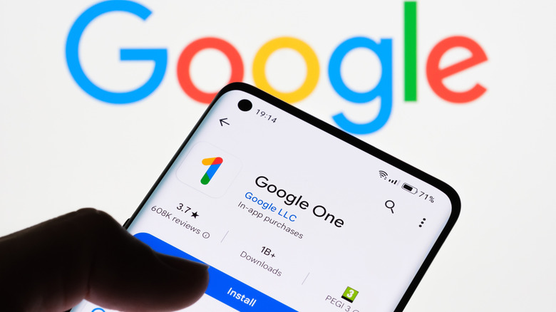 Google One on a phone screen with Google logo in the background