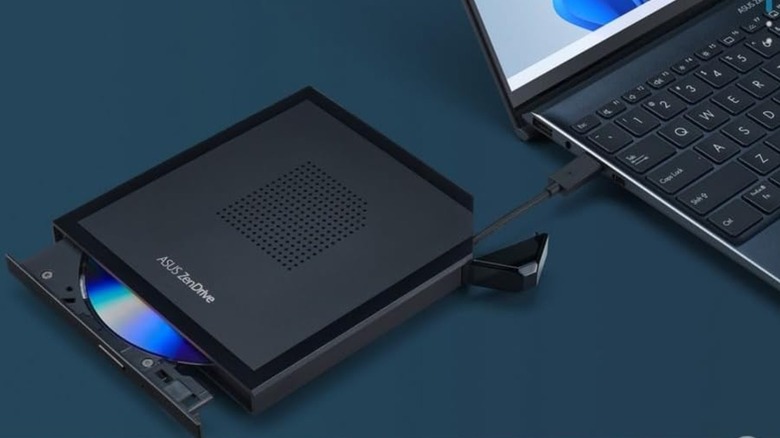 An Asus ZenDrive DVD drive connected to a laptop