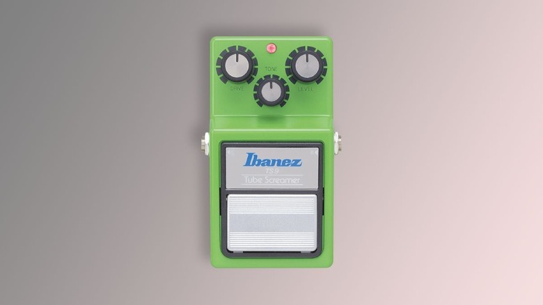 The Ibanez tube screamer guitar pedal on a gray background.