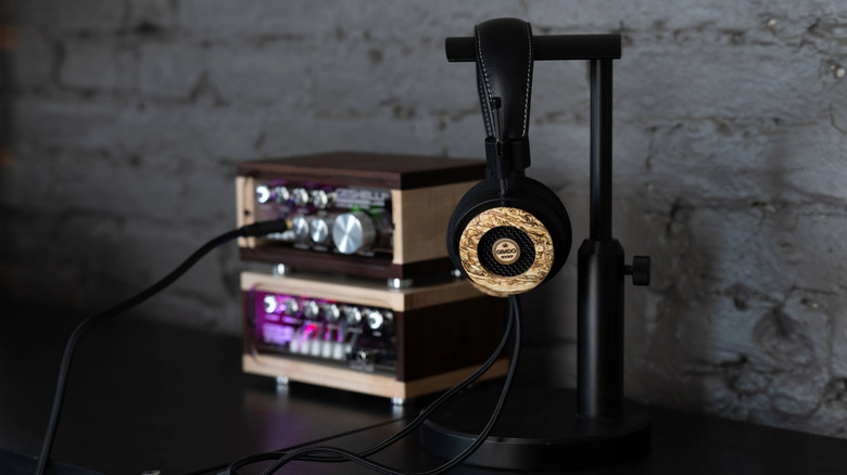 The Grado Hemp headphones on stand, plugged into an amplifier