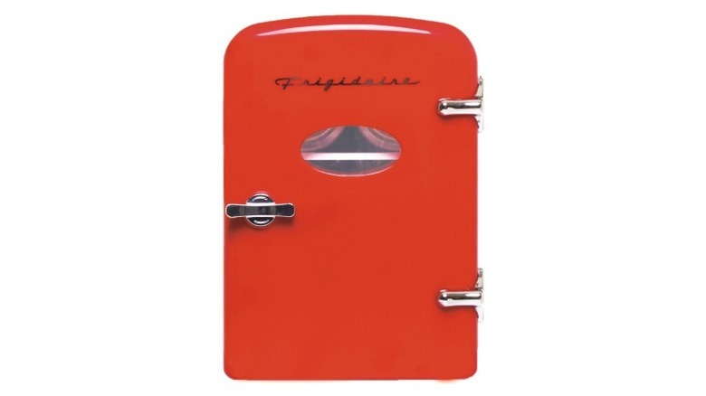 A red Frigidaire mini fridge