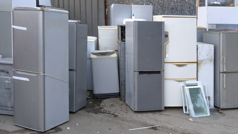 A pile of broken refrigerators