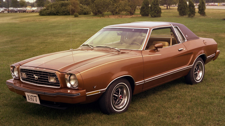 Photo of an orange 1977 Mustang.