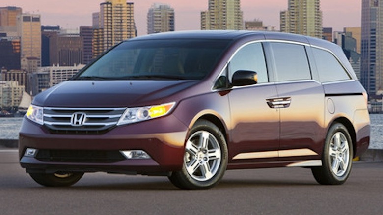 Photo of a dark colored 2013 Honda Odyssey Touring Elite.