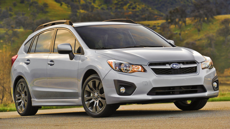 Photo of a silver 5-door 2012 Subaru Impreza.